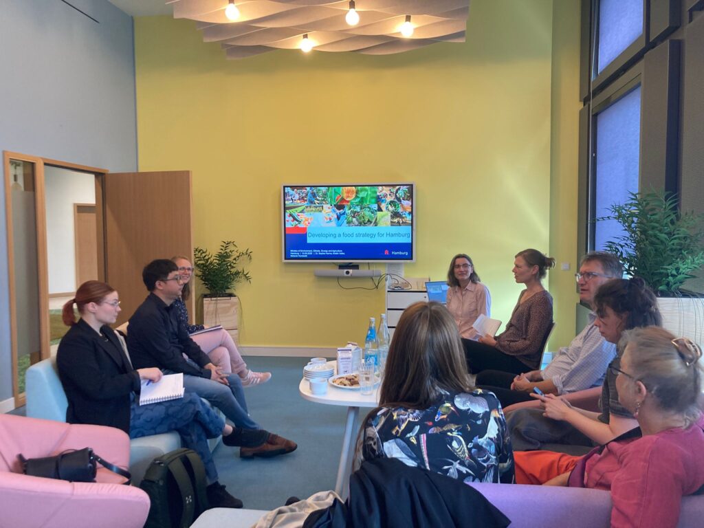 A team meeting in a yellow conference room